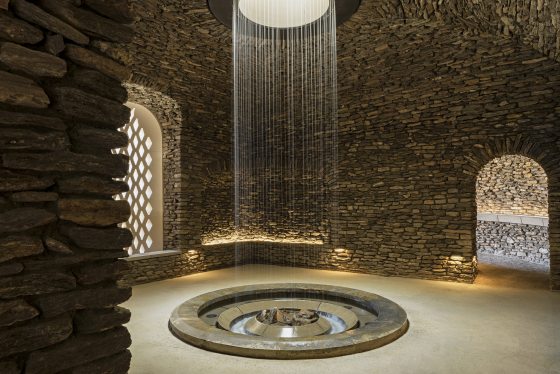 indoor daytime image of water cascading in the grotto
